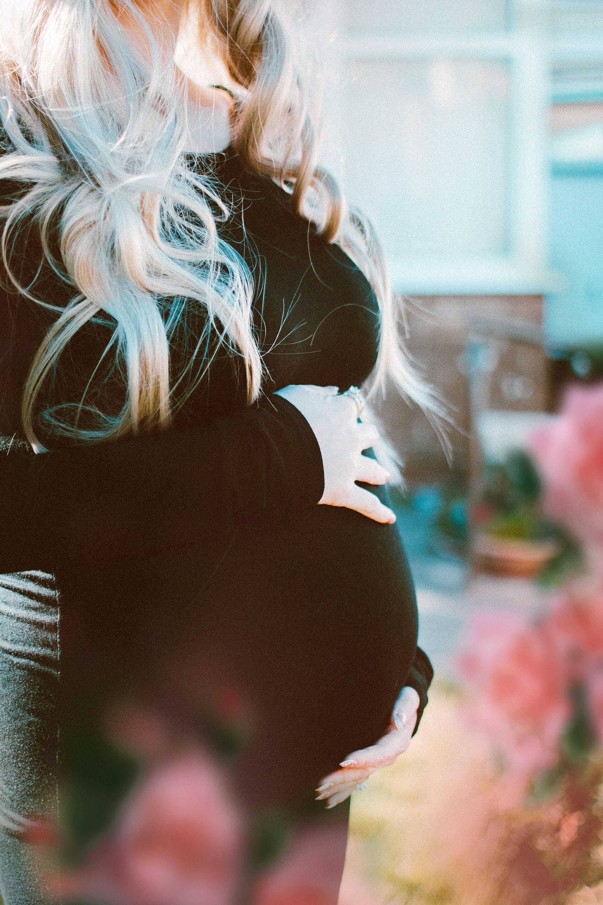 Pregnant woman in black long sleeves